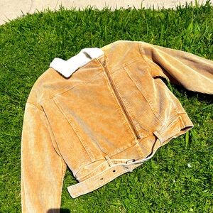 Tan zip Jacket 
Fuzzy in the inside
